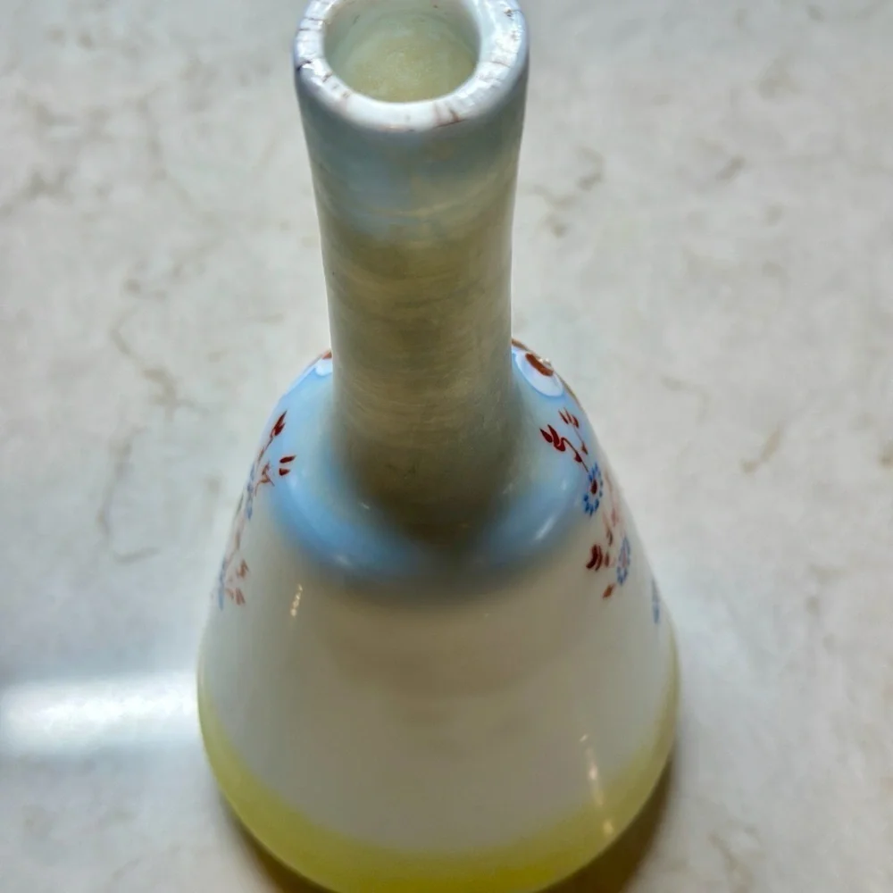 ANTIQUE BARBER SHOP BOTTLE WITH ATTRACTIVE CHERUB PICTURED ON FRONT SIDE.